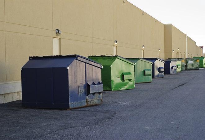 a row of industrial dumpsters at a construction site in Burke